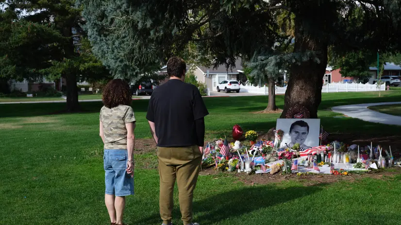 epaselect epa12373918 People look at tributes to slain conservative political activist Charlie Kirk, in Provo, Utah, USA, 12 September 2025 (issued 13 September 2025). Kirk was shot and killed on 10 September during a stop on his American Comeback Tour organized by Turning Point USA at Utah Valley University. Tyler Robinson has been arrested and identified as the suspected shooter. EPA/LINDSAY D'ADDATO