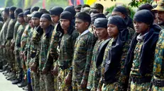 epa08154556 Militants wait in queue to lay down their arms in a surrender ceremonery in Guwahati, Assam, India, 23 January 2020. A total of 644 militants of eight banned insurgent outfits of north east India including United Liberation Front Asom (ULFA), National Democratic Front of Boroland (NDFB), Rabha National Liberation Front (RNLF), Kamtapur Liberation Organisation (KLO), CPI (Maoist), National Liberation Front of Bengali (NLFB) surrendered in Assam along with 177 arms. EPA/STR