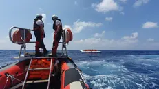 epa07780654 A handout photo dated 09 August 2019 and made available by Doctors Without Borders (MSF) on 19 August 2019, showing rescue vessel Ocean Viking crew members approaching a boat with migrants off the coast of Libya in the Mediterranean. The vessel, that has been at sea since 10 days, rescued a total of 356 migrants in three rescue missions. Over 500 refugees on two NGO vessels are still waiting to be allowed at land while Italy and Malta have denied them access to their harbors. EPA/HANNAH WALLACE BOWMAN HANDOUT HANDOUT EDITORIAL USE ONLY/NO SALES