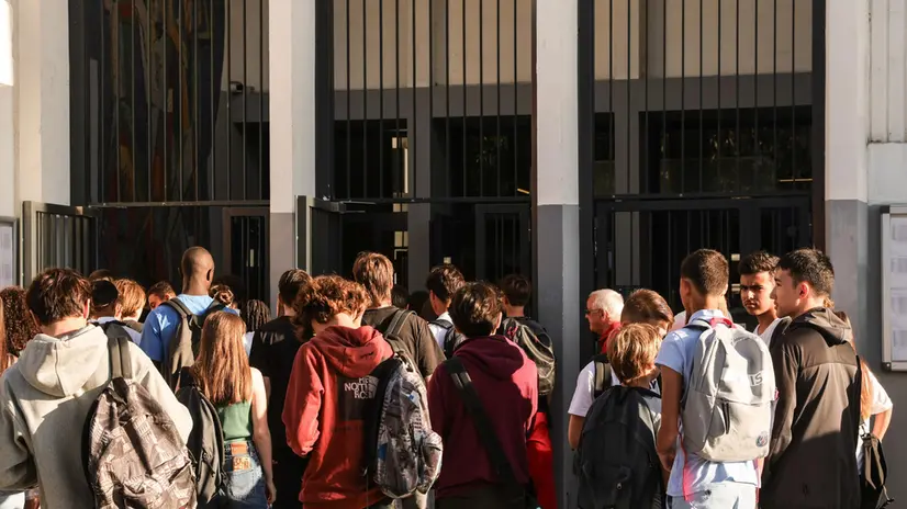 epa10839277 Students wait for the opening of the doors of the Maurice Ravel high school in Paris, France, 04 September 2023. The back-to-school season in France takes place under the general baccalaureate reform, the lack of teachers and the controversies surrounding the dress code of the students. EPA/TERESA SUAREZ