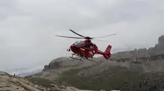 epa07813171 A handout picture provided by the Italian National alpin cliff and cave rescue corp (Cnsas) shows an helicopter during a rescue operation to save two Spanish climbers stuck on a Dolomite peak for three days, in Auronzo (Belluno), Northern Italy, 02 September 2019. Previously the couple had refused two helicopter attempts to rescue them, convinced they had reached the top of the Tre Cime di Lavaredo peak. EPA/CNSAS SOCCORSO ALPINO HANDOUT HANDOUT EDITORIAL USE ONLY/NO SALES