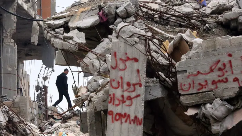 epa04634391 A Palestinian man walks among the rubble of destroyed buildings in Al Shejaiya neighbourhood in the east of Gaza City, 23 February 2015. On 15 February 2014, international mediator and former British prime minister Tony Blair said if conditions in the impoverished Gaza Strip remained the same, then it would be a 'crime against humanity.' Blair, the envoy of the so-called Quartet of Middle East peace mediators, had visited the coastal enclave for several hours, six months after a deadly and destructive Israeli offensive in the strip, launched in response to years of rocket attacks. EPA/MOHAMMED SABER