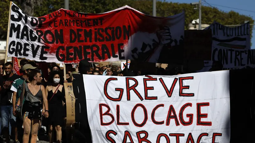 epa12386561 People are demonstrating against austerity measures in the upcoming budget in Montpellier, France, 18 September 2025. French unions call for a nationwide strike and mass protests against the planned cuts in the government's draft budget for 2026. EPA/GUILLAUME HORCAJUELO