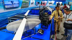 epa12386140 Visitors observe a UAV control panel on display during the Taipei Aerospace and Defense Technology Exhibition in Taipei, Taiwan, 18 September 2025. The Taipei Aerospace & Defense Technology Exhibition (TADTE 2025), organized by the Taiwan External Trade Development Council (TAITRA), is taking place Sept. 18 to 20 and marks the largest edition yet, featuring over 400 exhibitors from 14 countries, including the U.S., France, and Germany, across more than 1,400 booths to showcase cutting-edge defense technologies, aerospace systems, unmanned platforms, and space innovations. EPA/RITCHIE B. TONGO