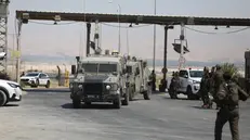 epa11593037 Israeli security forces arrive near the site where a truck driver opened fire at Allenby Bridge, also known as the King Hussein Bridge, crossing between Jordan and the West Bank, near Jericho, West Bank, 08 September 2024. Three Israelis were killed in a shooting attack at the border crossing, the Israeli army said in a post on social media. The driver approached the area of the Allenby Bridge from Jordan in a truck, exited the truck, and opened fire at the Israeli security forces operating at the bridge, the Israeli Defence Forces (IDF) reported. EPA/Jamal Awwad