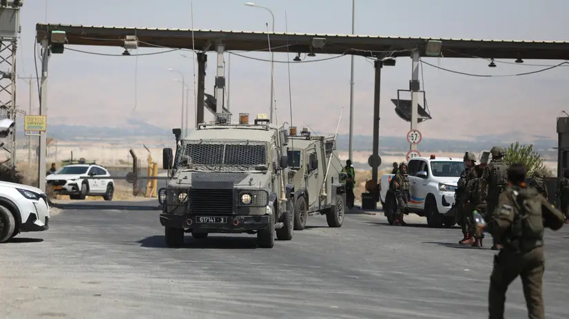 epa11593037 Israeli security forces arrive near the site where a truck driver opened fire at Allenby Bridge, also known as the King Hussein Bridge, crossing between Jordan and the West Bank, near Jericho, West Bank, 08 September 2024. Three Israelis were killed in a shooting attack at the border crossing, the Israeli army said in a post on social media. The driver approached the area of the Allenby Bridge from Jordan in a truck, exited the truck, and opened fire at the Israeli security forces operating at the bridge, the Israeli Defence Forces (IDF) reported. EPA/Jamal Awwad