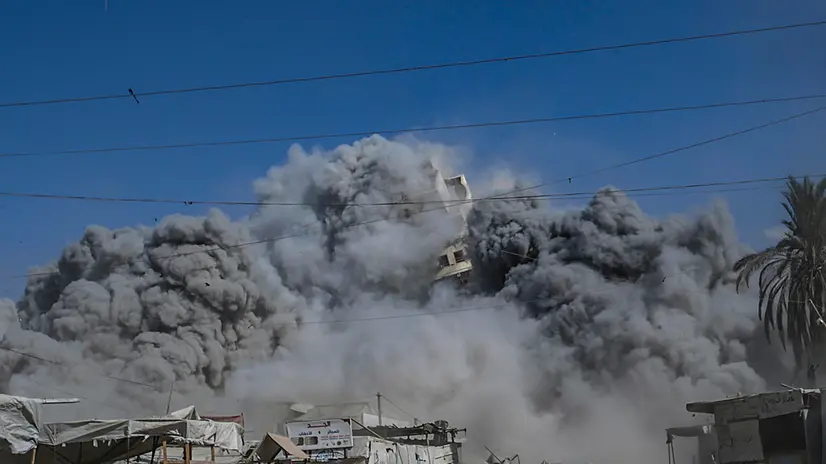 epa12362369 The al-Roya residential building collapses following an Israeli airstrike in the west of Gaza City, Gaza Strip, 08 September 2025. Israel confirmed the strike, claiming the building was housing 'intelligence gathering means'. EPA/MOHAMMED SABER