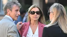 L’allenatrice delle Farfalle della Ginnastica Artistica, Emanuela Maccarani (in rosa), insieme al suo avvocati Amilio Presutti e Daniela De Domenico a margine della sentenza. Roma, 29 settembre 2023. ANSA/CLAUDIO PERI