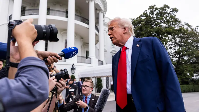 epa12395755 US President Donald Trump speaks to reporters before departing the White House for the funeral of slain conservative activist Charlie Kirk in Washington, DC, USA, 21 September 2025. The president answered questions about Kirk, as well as about Defense Secretary Pete Hegseth's new 'pledge' requirement for reporters. EPA/JIM LO SCALZO / POOL