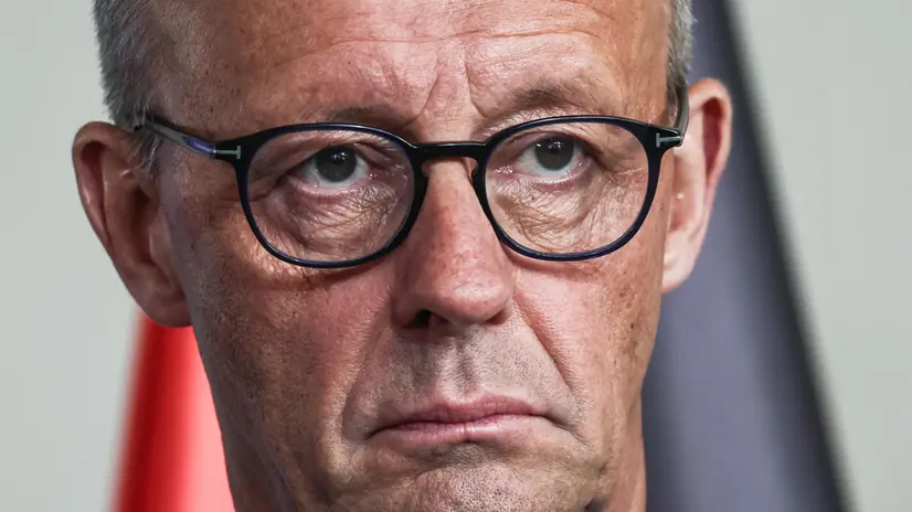epa12397714 German Chancellor Friedrich Merz attends a press conference with new Chief Investment Officer Martin Blessing (unseen) at the Chancellery in Berlin, Germany, 22 September 2025. EPA/FILIP SINGER