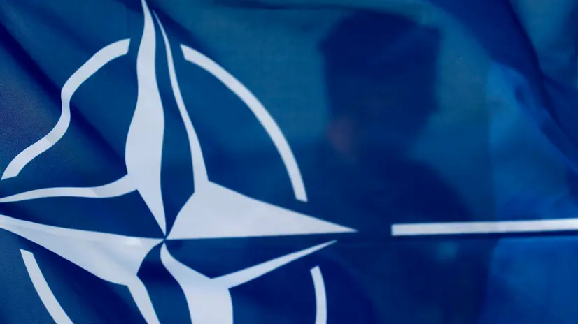 epa12141041 A NATO flag is seen during Media Day at the 'Latvian Shield 25' exercise at the Riga Hydroelectric Power Plant in Dole, Latvia, 28 May 2025. The exercise strengthens cooperation between Spanish and Latvian Air Force air defense units, enhancing the ability of Latvian and other NATO forces to jointly respond to air defense challenges. EPA/TOMS KALNINS