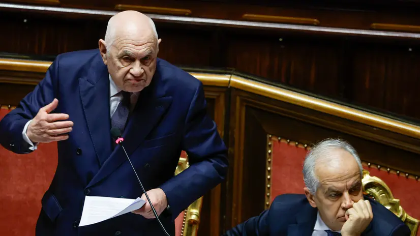Italy's Justice Minister Carlo Nordio (L) and Interior Minister Matteo Piantedosi react during a government briefing over the case of Libyan General Osama Najim Almasri, at the Senate, Rome, Italy, 05 February 2025. On 21 January the Italian government released and repatriated Almasri after a brief detention over an International Criminal Court (ICC) arrest warrant. The general is wanted by the ICC over allegations of war crimes and crimes against humanity. ANSA/FABIO FRUSTACI
