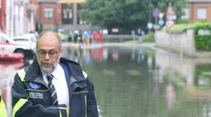 L'assessore alla Sicurezza del Comune di Milano Marco Granelli nei pressi del fiume Lambro, esondato in alcuni punti dagli argini. Milano, 15 maggio 2024. ANSA/PAOLO SALMOIRAGO
