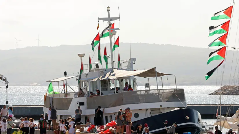 epa12372801 Participants of the Global Sumud Flotilla (GSF) wait to set sail towards Gaza along with other boats at the port of Bizerte, Tunisia, 13 September 2025. The Gaza-bound GSF flotilla is an international maritime initiative that began sailing in August 2025, aiming to break the Israeli blockade and deliver vital aid to the Gaza Strip. EPA/MOHAMED MESSARA