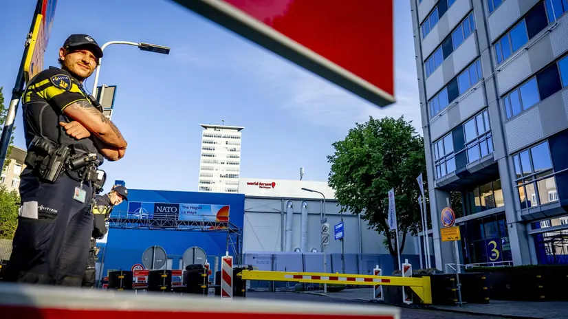 epa12186667 Police officers guard the area as high fences surround the World Forum, the venue of the upcoming NATO summit, in The Hague, the Netherlands, 20 June 2025. The Hague will host a NATO Summit from 24 to 25 June, the first such summit to be held in the Netherlands. EPA/ROBIN UTRECHT
