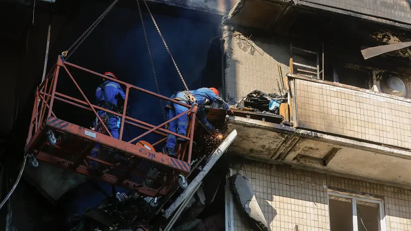 epa12359144 Ukrainian rescuers work at the site of a Russian strike on a nine-story residential building in Kyiv, Ukraine, 07 September 2025, amid the Russian invasion. At least two people were killed, including a child, and dozens were injured after Russian forces launched an overnight attack over Ukraine with more than 800 drones and 13 missiles, according to the State Emergency Service of Ukraine. EPA/SERGEY DOLZHENKO