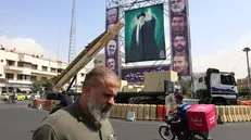 epa12409856 An Iranian Kheibar-Shekan medium-range ballistic missile (MRBM) placed next to a large banner depicting Iranian supreme leader Ayatollah Ali Khamenei (C) in Baharestan Square in Tehran, Iran, 27 September 2025. According to state media, Iran has recalled its envoys to Britain, France, and Germany for consultations after the three countries (E3) initiated a 'snapback' process to restore UN sanctions over Iran's alleged failure to meet its nuclear program commitments. EPA/ABEDIN TAHERKENAREH