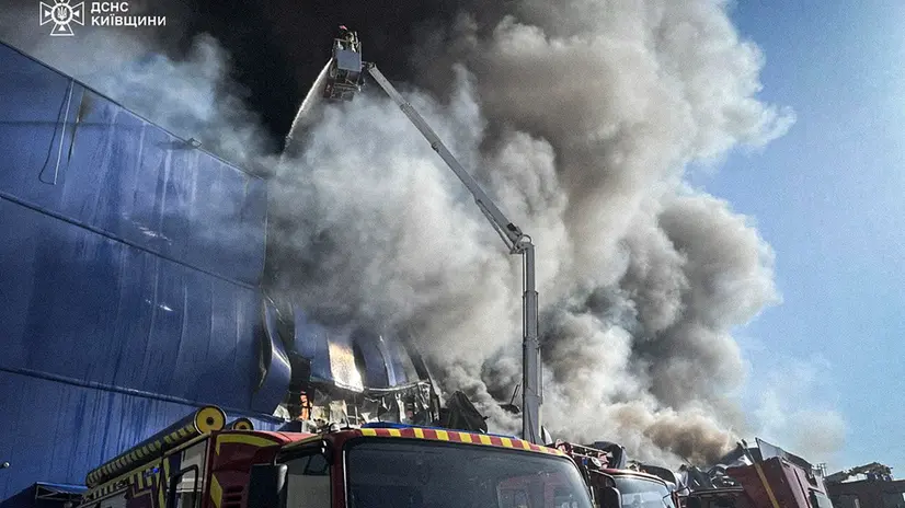 epa12382180 A handout photo made available by the Ukrainian State Emergency Service shows Ukrainian rescuers working at the site of a Russian drone strike on a warehouse belonging to a trading network of construction trade shops near Kyiv, Ukraine, early 16 September 2025, amid the Russian invasion. No deaths or injuries were reported after the overnight Russian attack in the Kyiv area, according to the State Emergency Service of Ukraine. EPA/STATE EMERGENCY SERVICE OF UKRAINE HANDOUT HANDOUT EDITORIAL USE ONLY/NO SALES
