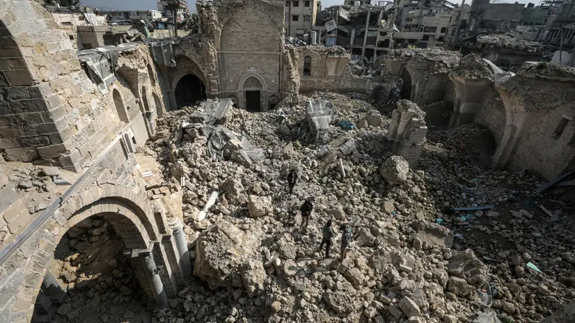 epa11866157 Palestinians walk among the ruins of the Great Omari Mosque, damaged during the Israeli-Hamas conflict, amidst a ceasefire in the Old City of Gaza, Gaza Strip, 31 January 2025. Israel and Hamas implemented the first phase of a hostage release and ceasefire deal on 19 January 2025. More than 46,000 Palestinians have been killed in the Gaza Strip, according to the Palestinian Ministry of Health, since Israel launched a military campaign in the strip in response to a cross-border attack led by the Palestinian militant group Hamas on 07 October 2023, in which about 1,200 Israelis were killed and more than 250 taken hostage. EPA/MOHAMMED SABER