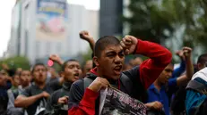 epa12409029 People take part in a protest on the anniversary of the disappearance of 43 Ayotzinapa students, in Mexico City, Mexico, 26 September 2025. Eleven years after the 43 students from the Ayotzinapa Rural Teachers' College in the state of Guerrero were forcibly disappeared by members of the Mexican Army, thousands of people, including the parents of the students, took to the streets of the nation's capital to demand justice in one of the most well-known human rights violations cases in Mexico. EPA/Sashenka Gutierrez
