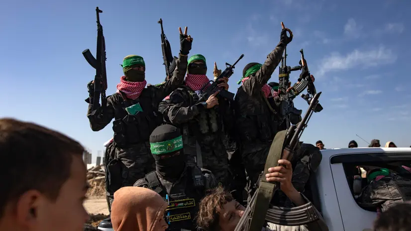 epaselect epa11897711 Fighters from the Izz ad-Din al-Qassam Brigades arrive prior to a handover ceremony of three Israeli hostages to the Red Cross, in Khan Yunis, southern Gaza Strip, 15 February 2025. Hamas on 15 February released three Israeli hostages in exchange for 369 Palestinians detained in Israeli prisons. Israel and Hamas implemented the first phase of a hostage release and ceasefire deal on 19 January 2025. EPA/HAITHAM IMAD