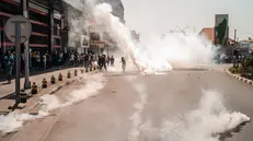 epa12405386 Police fire tear gas to disperse protesters during a rally in Antananarivo, Madagascar, 25 September 2025. Security forces used tear gas and rubber bullets against hundreds of demonstrators protesting recurrent water and power outages. EPA/HENITSOA RAFALIA