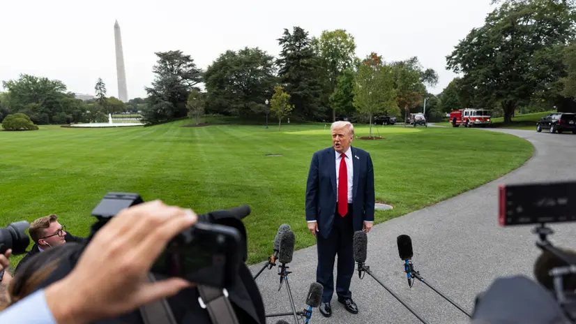 epa12417375 US President Donald Trump speaks with the media after returning to the White House from a meeting with military leaders at Quantico Marine Base in Washington, DC, USA, 30 September 2025. He spoke briefly about lowering drug prices, saying 'we will be reducing drug prices by 100 percent in some cases, 300 percent or more'. EPA/JIM LO SCALZO