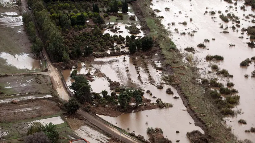 Immage from helicopter of cyclone in Sardinia (Italy). Uras (Oristano), 21 November 2013. Authorities said 16 people had been killed by Cyclone Cleopatra, revising down a death toll of 18, as extreme rainfall inundated houses and country. ANSA/GIUSEPPE UNGARI