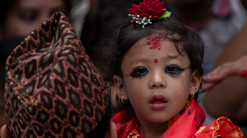 epa12416075 Nepal's newly appointed Living Goddess, Kumari Aryatara Shakya, 2 years old, looks on in her private home before she is formally taken to the Kumari House in Kathmandu, Nepal, 30 September 2025. Aryatara Shakya was appointed as the new Kumari after her predecessor, Trishna Shakya, retired upon reaching puberty. The Living Goddess is a young pre-pubescent girl considered an incarnation of the Hindu Goddess of Power, Kali. The Kumari retires when she reaches puberty. As Kumari, Aryatara no longer goes to school, plays outside, or touches her friends — all of which are considered to make her ritually impure. EPA/NARENDRA SHRESTHA