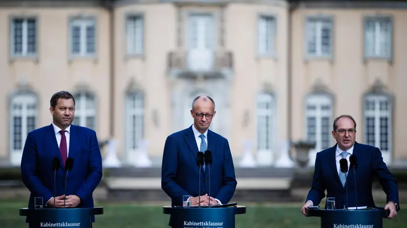 epa12419482 (L-R) German Finance Minister Lars Klingbeil, German Chancellor Friedrich Merz and German Interior Minister Alexander Dobrindt attend a press conference on the second day of a closed meeting of the German federal cabinet at Villa Borsig in Berlin, Germany, 01 October 2025. The federal cabinet held a closed-door meeting from 30 September to 01 October 2025 in Berlin. EPA/CLEMENS BILAN