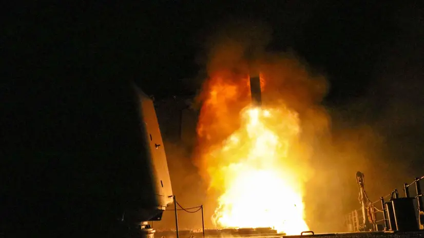 epa06668821 Image dated 14 April 2018 provided by the US Navy showing the guided-missile cruiser USS Monterey (CG 61) fires a Tomahawk land attack missile. Monterey is deployed to the U.S. 5th Fleet area of operations in support of maritime security operations to reassure allies and partners and preserve the freedom of navigation and the free flow of commerce in the region. EPA/Matthew Daniels HANDOUT EDITORIAL USE ONLY/NO SALES