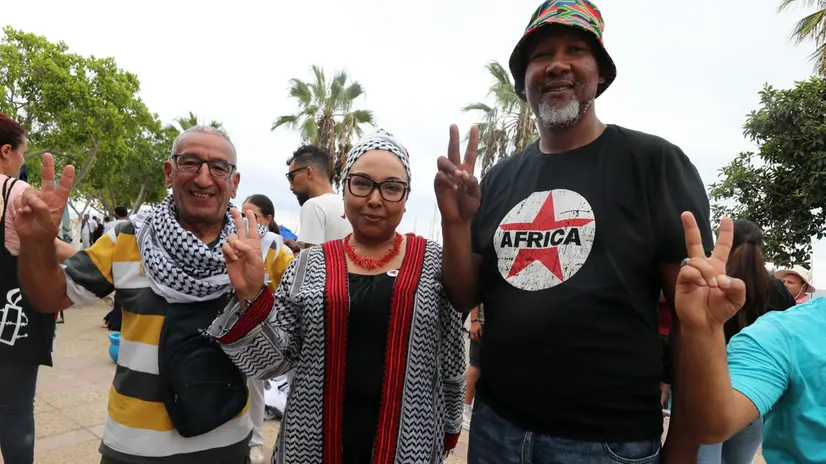 epa12367972 South African activist Mandla Mandela (R), a grandson of Nelson Mandela, and activists from the Sumud Global Flotilla gather before the flotilla's planned departure for the Gaza Strip at the port of Sidi Bou Said, Tunisia, 10 September 2025. The Global Sumud Flotilla (GSF) will depart from Tunis to Gaza on 10 September as part of a humanitarian effort. GSF is an international maritime initiative, launched and led by non-governmental organizations, aiming to break the Israeli blockade of the Gaza Strip and deliver vital aid. EPA/MOHAMED MESSARA