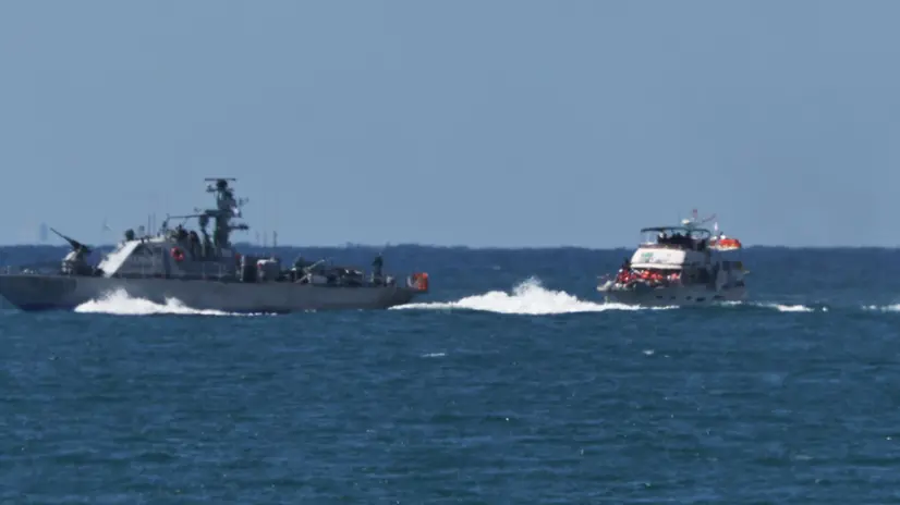 epa12423084 An Israeli navy vessel arriving at Ashdod port 02 October 2025 after intercepting boats carrying aid to Gaza and detaining activists aboard, including Swedish climate campaigner Greta Thunberg. Israel's Foreign Ministry announced that several vessels that form part of the Global Sumud Flotilla (GSF) had been stopped and that those aboard were being transferred to an Israeli port. EPA/ATEF SAFADI