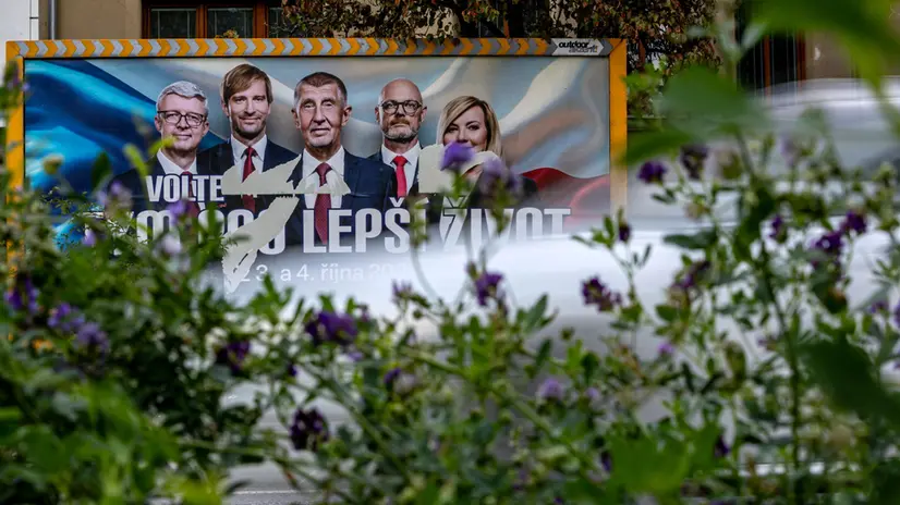 epa12423820 Cars pass an election poster of Andrej Babis, former Czech Prime Minister and leader of the ANO (YES) movement, in Prague, Czech Republic, 02 October 2025. The Czech Republic will head to the polls on 03 and 04 October 2025 to elect a new parliament. The slogan reads: 'Vote for a team for a better life.' EPA/MARTIN DIVISEK