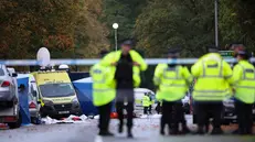 epa12426619 Police officers work at the scene of a fatal terror attack in Manchester, Britain, 03 October 2025. Two people died after a car and stabbing attack at a synagogue in Manchester on 02 October, and the attacker, who has been named as 35-year-old British citizen Jihad Al-Shamie, was shot by police. EPA/ADAM VAUGHAN