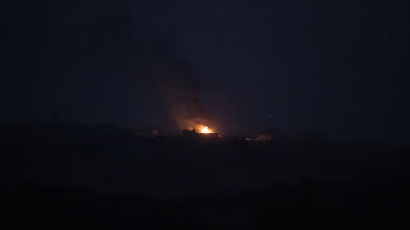 epa10991017 A fire breaks out after an explosion at night following an Israeli strike on the northern part of the Gaza Strip, as see from Sderot, southern Israel, 23 November 2023. As part of Israel's 'ground operation' in the Gaza Strip, aerial strikes were carried out on over 300 Hamas targets over the last day, the IDF announced on 23 November. More than 14.000 Palestinians and at least 1,200 Israelis have been killed, according to the Gaza Government media office and the Israel Defense Forces (IDF), since Hamas militants launched an attack against Israel from the Gaza Strip on 07 October, and the Israeli operations in Gaza and the West Bank which followed it. EPA/CHRISTOPHE PETIT TESSON
