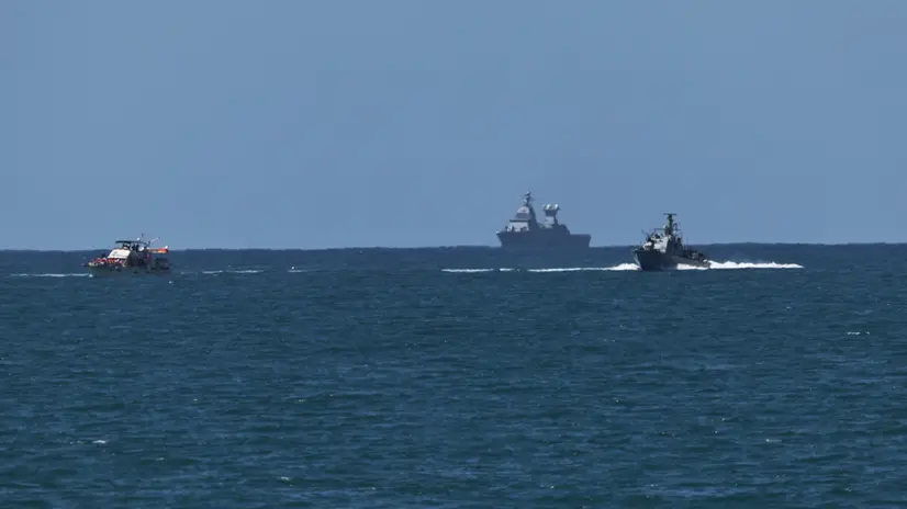 epa12423109 Israeli navy vessels arriving at Ashdod port 02 October 2025 after intercepting boats carrying aid to Gaza and detaining activists aboard, including Swedish climate campaigner Greta Thunberg. Israel's Foreign Ministry announced that several vessels that form part of the Global Sumud Flotilla (GSF) had been stopped and that those aboard were being transferred to an Israeli port. EPA/ATEF SAFADI