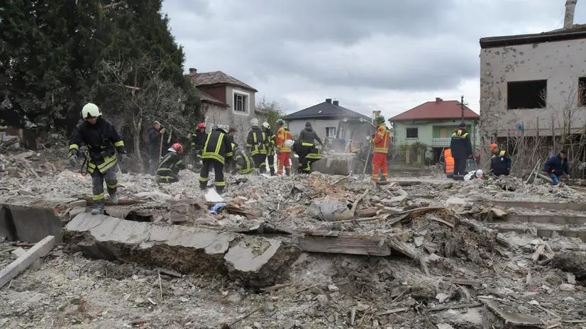 epa12432162 Ukrainian rescuers work at the site of a Russian strike in the Lapoivka village near Lviv, Western Ukraine, on the night of 05 October 2025, amid the ongoing Russian invasion. According to the State Emergency Service report, at least five people died and dozens were injured after Russia launched an overnight attack on Ukraine with more than 50 missiles of different types and 500 shock drones. The Lviv, Ivano-Frankivsk, Zaporizhia, Chernihiv, Sumy, Kharkiv, Kherson, Odesa, and Kirovohrad regions experienced a massive combined attack overnight. EPA/MYKOLA TYS
