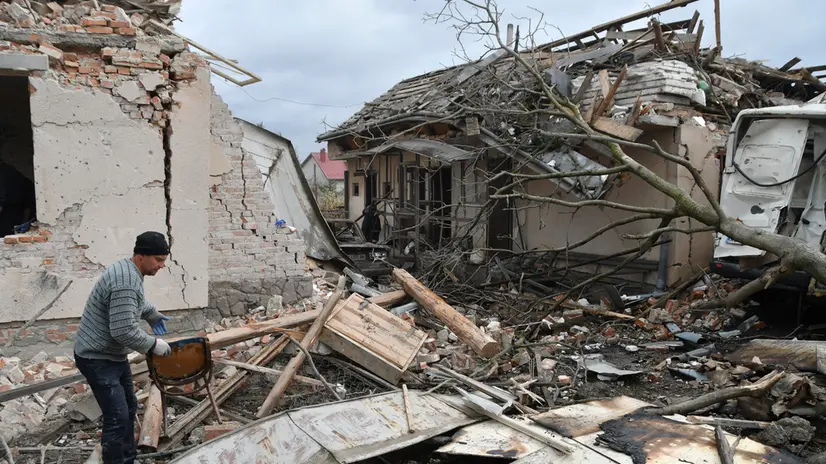 epaselect epa12432168 A lman inspects the site of a Russian strike in the Lapoivka village near Lviv, Western Ukraine, on the night of 05 October 2025, amid the ongoing Russian invasion. According to the State Emergency Service report, at least five people died and dozens were injured after Russia launched an overnight attack on Ukraine with more than 50 missiles of different types and 500 shock drones. The Lviv, Ivano-Frankivsk, Zaporizhia, Chernihiv, Sumy, Kharkiv, Kherson, Odesa, and Kirovohrad regions experienced a massive combined attack overnight. EPA/MYKOLA TYS