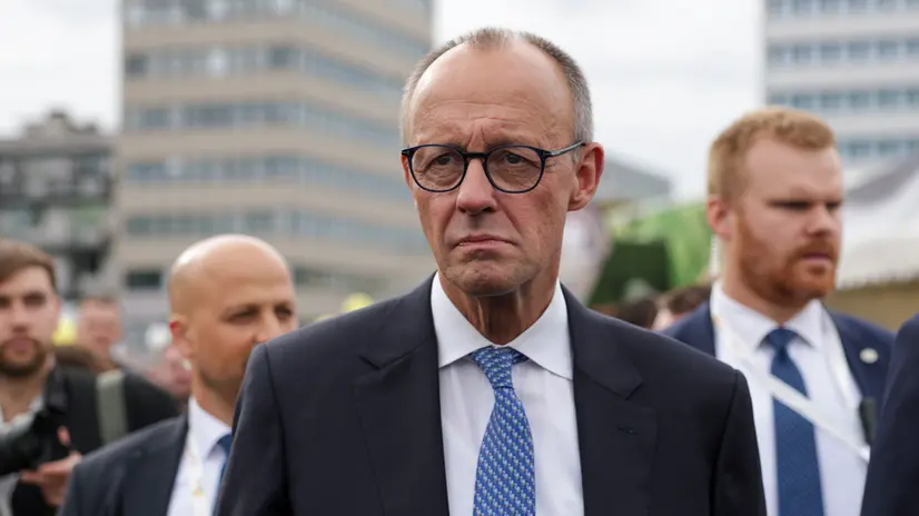 epaselect epa12428230 German Chancellor Friedrich Merz looks on during a tour after celebrations for the Day of German Unity 2025 in Saarbruecken, Germany, 03 October 2025. German Unity Day is celebrated annually on 03 October to commemorate the reunification of East and West Germany in 1990. EPA/CHRISTOPHER NEUNDORF