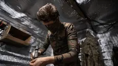 epa12256343 Drone engineer from the 20th Lyubart Brigade of the 1st Corps of the National Guard of Ukraine Azov prepares a FPV drone armed with explosives for an attack mission on the frontline in Toretsk, Donetsk region, Ukraine, 22 July 2025 (issued 23 July 2025). First Person View (FPV) drones have become one of the most widely used weapons by the Ukrainian and Russian armies in the conflict in Ukraine EPA/MARIA SENOVILLA