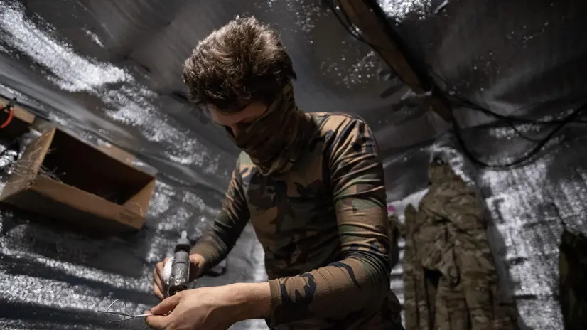 epa12256343 Drone engineer from the 20th Lyubart Brigade of the 1st Corps of the National Guard of Ukraine Azov prepares a FPV drone armed with explosives for an attack mission on the frontline in Toretsk, Donetsk region, Ukraine, 22 July 2025 (issued 23 July 2025). First Person View (FPV) drones have become one of the most widely used weapons by the Ukrainian and Russian armies in the conflict in Ukraine EPA/MARIA SENOVILLA