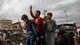 epa12441293 Internally displaced Palestinians celebrate the announcement of a ceasefire agreement between Hamas and Israel in Khan Younis, southern Gaza Strip, 09 October 2025. US President Donald Trump announced that Israel and Hamas have agreed to the first phase of a Gaza peace plan. The deal involves the release of Israeli hostages and Palestinian prisoners, the withdrawal of Israeli forces, and the delivery of humanitarian aid to Gaza. EPA/HAITHAM IMAD