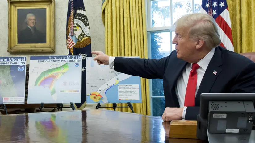 epa07084001 US President Donald J. Trump delivers remarks to members of the news media beside maps of the projected path of Hurricane Michael; while meeting with US Secretary of Homeland Security Kirstjen Nielsen and Administrator of the Federal Emergency Management Agency (FEMA) Brock Long in the Oval Office of the White House in Washington, DC, USA, 10 October 2018. Hurricane Michael is projected to hit Florida within hours carrying winds over 100 miles per hour. EPA/MICHAEL REYNOLDS