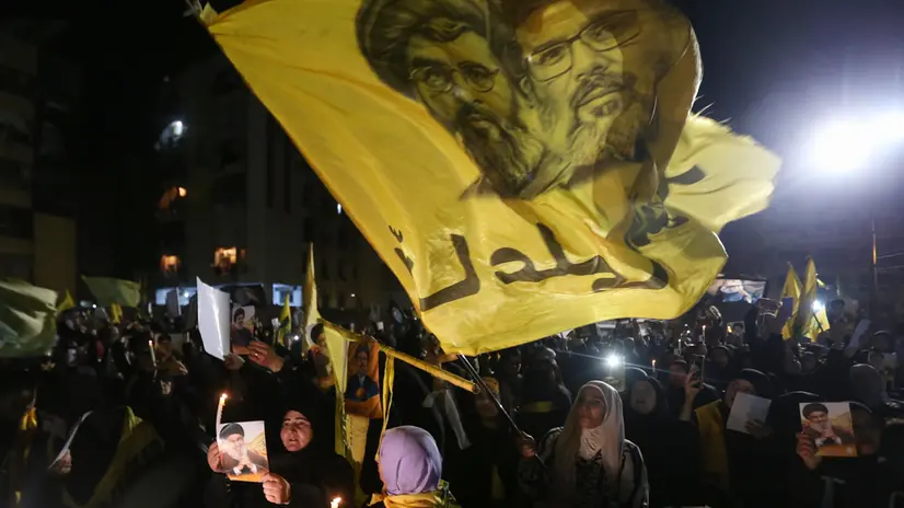epa12408642 Supporters of Lebanese Shia Islamist party and paramilitary group Hezbollah carry pictures of former Hezbollah leader Hassan Nasrallah during a gathering to mark the death anniversary of Nasrallah at the site where he died in Beirut, Lebanon, 26 September 2025. Nasrallah was killed in an Israeli airstrike targeting a Hezbollah command center in Haret Hreik, southern Beirut on 27 September 2024. EPA/WAEL HAMZEH