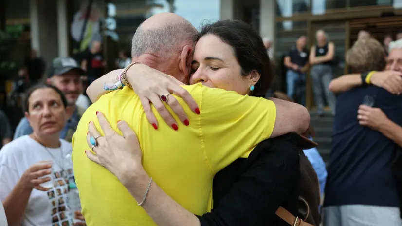 epaselect epa12440940 Itzik Horn, father of kidnapped Eitan Horn (L), celebrates after a peace deal is announced at Hostages Square in Tel Aviv, Israel, 09 October 2025. US President Donald Trump announced that Israel and Hamas have agreed on the first phase of his Gaza peace plan. The deal involves the release of Israeli hostages and Palestinian prisoners, the withdrawal of Israeli forces, and the delivery of humanitarian aid to Gaza. EPA/ABIR SULTAN