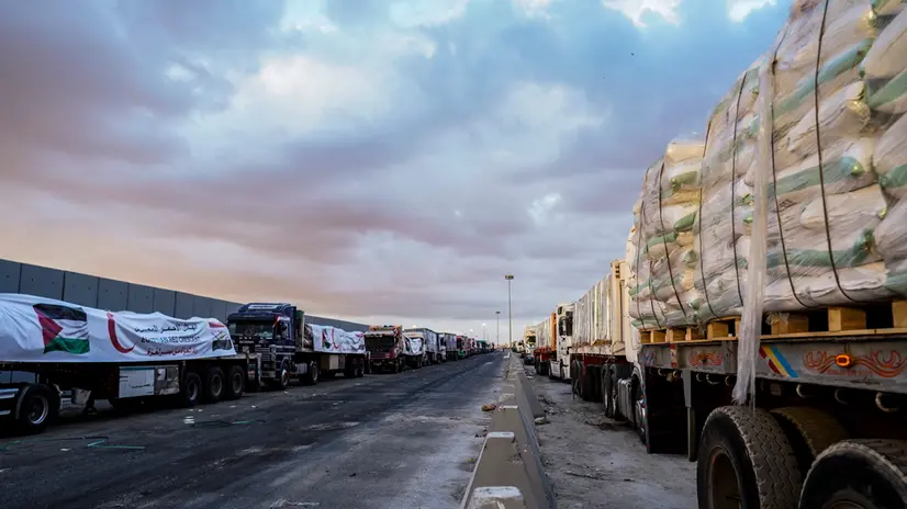 epa12447998 Humanitarian aid trucks are lined up before proceeding towards the Rafah border crossing, between Egypt and the Gaza Strip, in Rafah, North Sinai, Egypt, 12 October 2025. An increase of the number of trucks loaded with humanitarian aid were allowed into the Gaza Strip as part of the ceasefire agreement between Israel and Hamas, and ahead of the scheduled October 13th Sharm El-Sheikh Peace Summit to end the conflict in Gaza. EPA/STRINGER