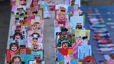 Un momento della Marcia per la Pace da Perugia ad Assisi.Sono decine di migliaia le persone che partecipano o assiepate lungo il percorso. Perugia, 12 ottobre 2025. ANSA / GIANLUIGI BASILIETTI