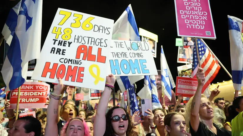 epa12447409 People celebrate during a rally at the so-called 'Hostages Square' outside the Kirya military headquarters in Tel Aviv, Israel, 11 October 2025. Tens of thousands are to gather at the "Hostages Square" ahead of the release of hostages held by Hamas. EPA/ABIR SULTAN