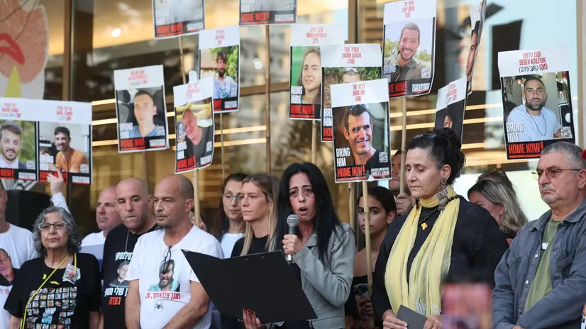 epa12446973 Einav Zangauker, mother of Israeli hostage Matan, and other families of hostages held by Hamas in Gaza delivers a statement at the so-called 'Hostages Square' outside the Kirya military headquarters in Tel Aviv, Israel, 11 October 2025. Thens of thousands are to gather at the "Hostages Square" ahead of the release of hostages held by Hamas. EPA/ABIR SULTAN